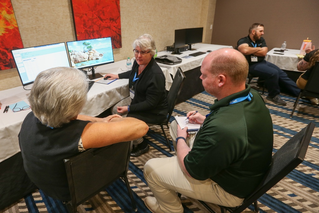 Employees and Customers sitting together in the Hands-On Room for 1-on-1 training and small group discussions.